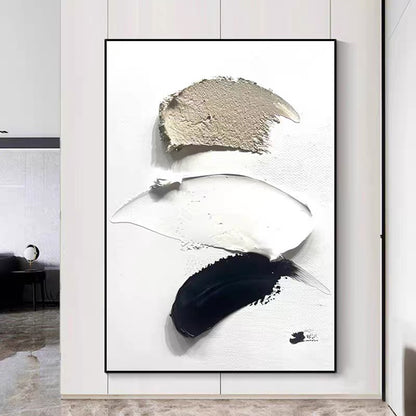Abstract art piece with black, white, and gray brush strokes in a modern interior setting.