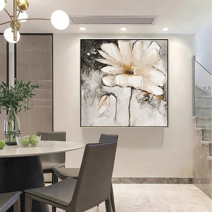 Dining room with a large abstract flower painting on the wall.