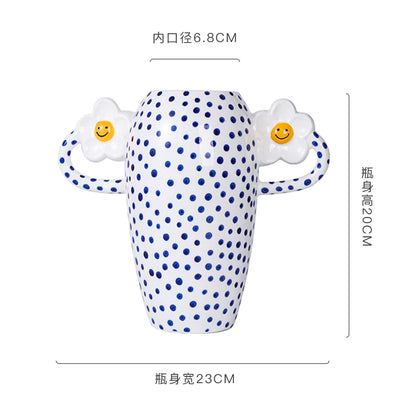 Polka dot bottle with cartoon faces on a white background