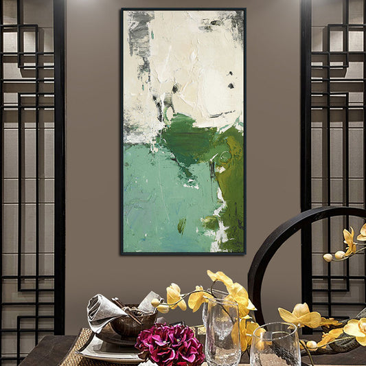 Abstract painting on a wall with decorative table setting below