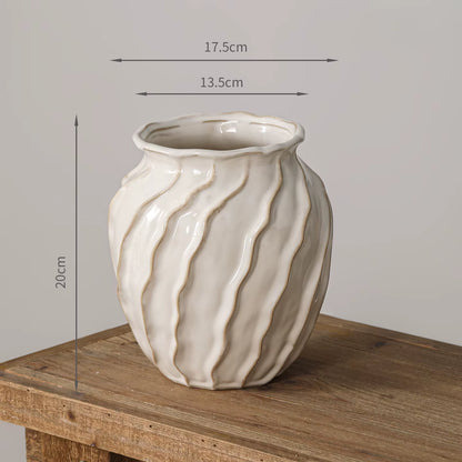 White ceramic vase with brown stripes on a wooden surface, shown with measurements.