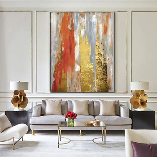 Modern living room with abstract art, gray sofa, and decorative elements.
