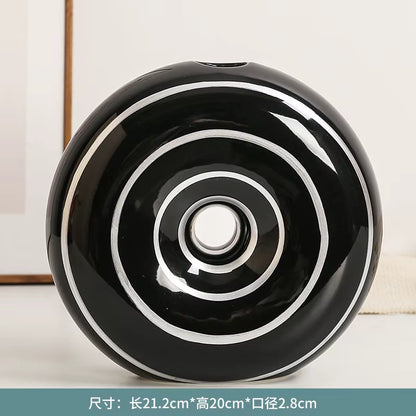 Black and white circular object on a light background