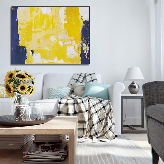 Modern living room with abstract art, sofa, and coffee table.