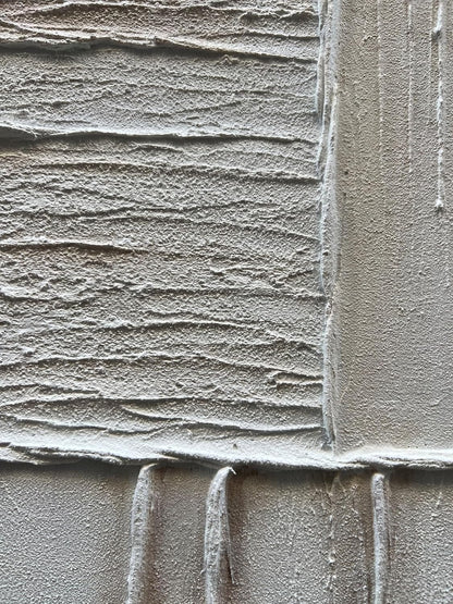 Close-up of textured concrete wall with horizontal and vertical patterns