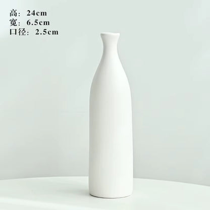 White ceramic bottle on a light gray background with dimensions displayed.