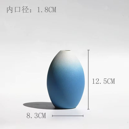 Blue gradient vase with measurements on a white background