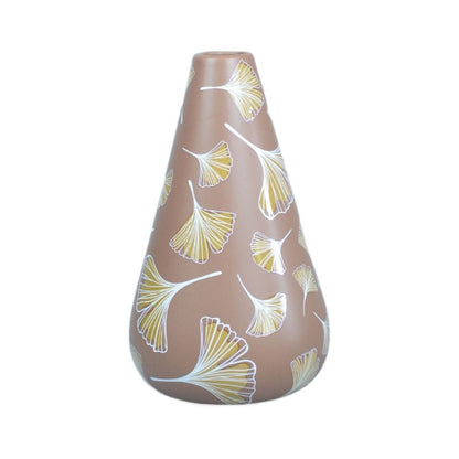Decorative vase with leaf pattern on a white background