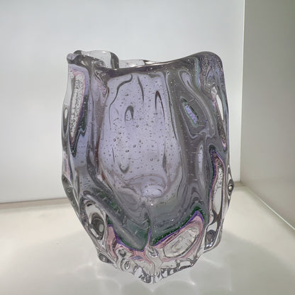 Glass vase with marbled design on a white background