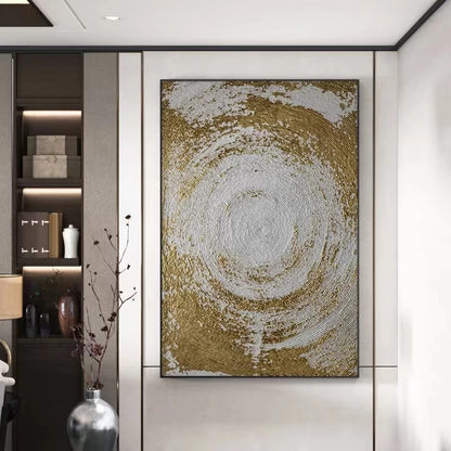 Decorative wall art with gold and white circular design in a modern interior setting.