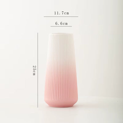 Pink and white gradient vase with dimensions on a light gray background