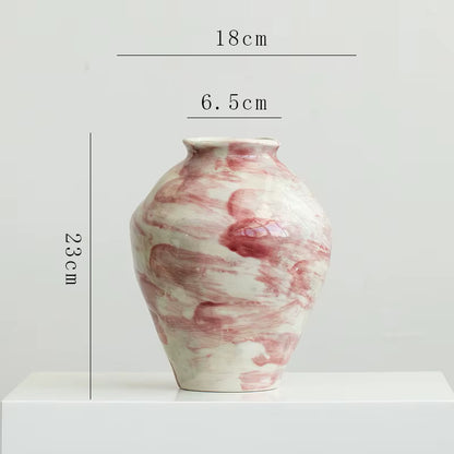 Marble-patterned vase with dimensions on a white background