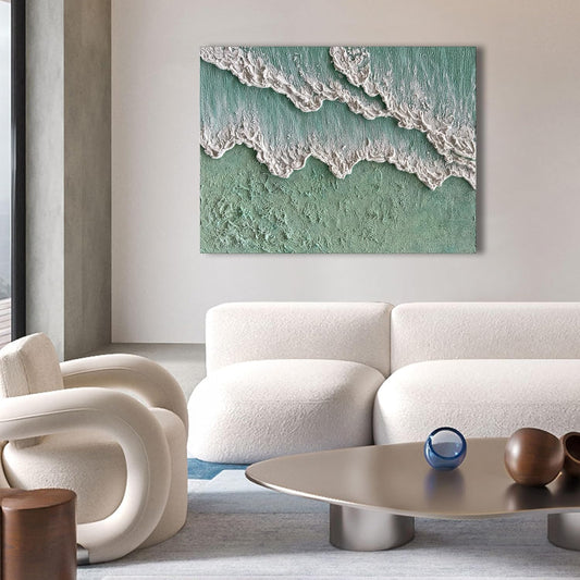 Modern living room with a white sofa, armchair, and coffee table, featuring a large abstract painting of waves on the wall.