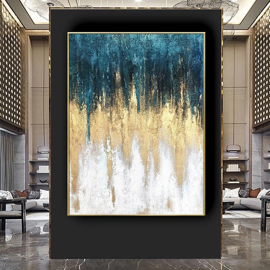 Abstract art painting with blue, gold, and white colors in a modern interior setting.