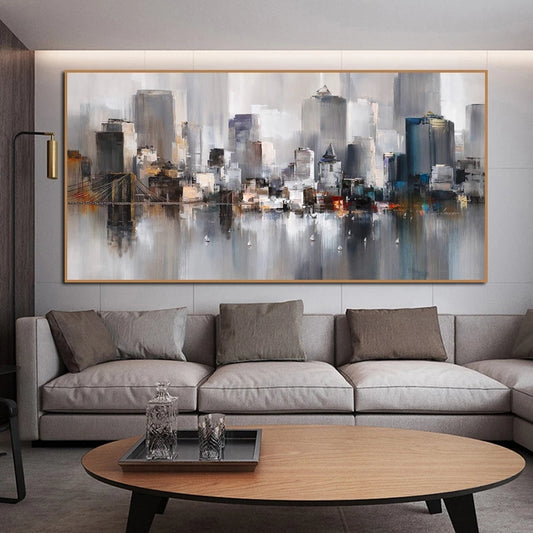 Modern living room with a large cityscape painting above a gray sectional sofa.