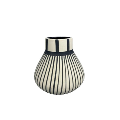 Striped vase with black and white pattern on a white background