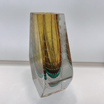 Glass vase with brown and clear design on a white background