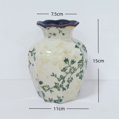 Ceramic vase with floral patterns and measurements on a white background