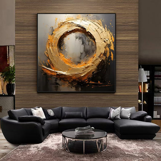 Modern living room with a black sectional sofa, round coffee table, and abstract painting on the wall.