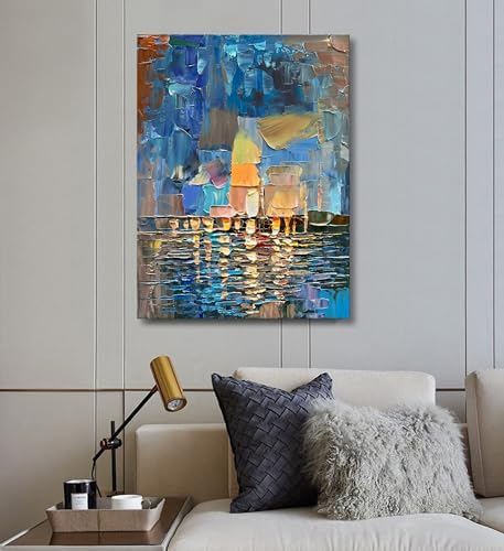 Abstract painting on a wall above a sofa with decorative pillows