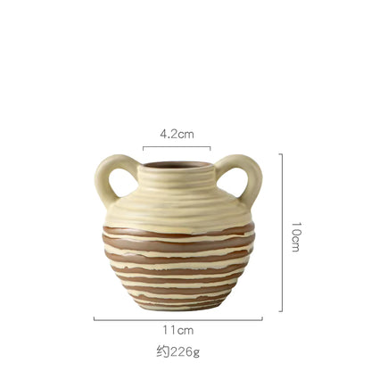 Ceramic vase with handles and dimensions on a white background