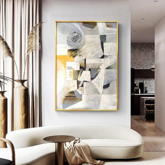 Modern living room with abstract art on the wall, white sofa, and decorative elements.
