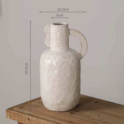 White textured vase with dimensions on a wooden surface and gray background