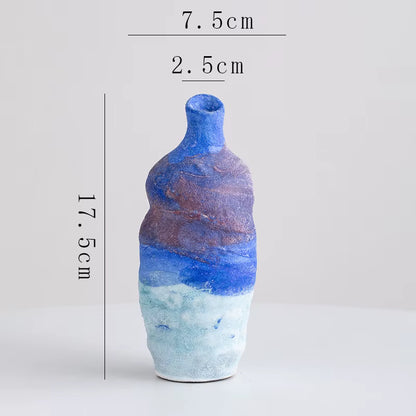 Blue and brown ceramic bottle with measurements on a white background
