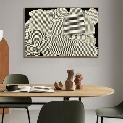 Abstract art piece on a wall above a dining table with decor items.