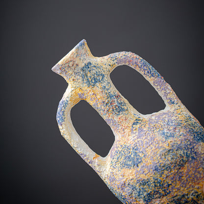 Rust-covered metal object on a dark background