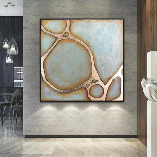 Abstract art piece on a wall in a modern interior setting