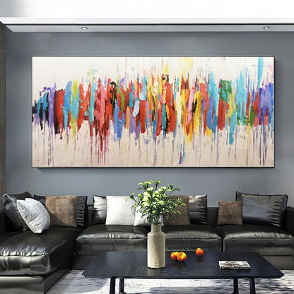 Living room with a large abstract painting on the wall above a black sofa.