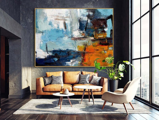 Modern living room with a brown sofa, abstract painting, and decorative elements.