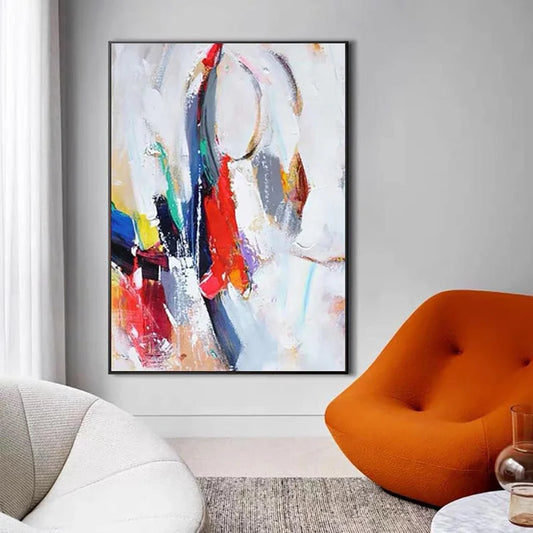 Abstract painting in a modern living room with an orange chair and gray walls.