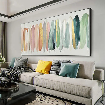 Living room with a gray sofa, colorful pillows, and a large abstract painting on the wall.