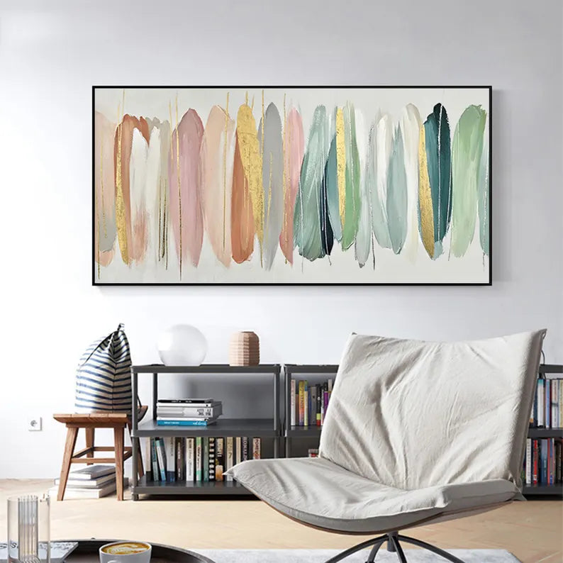 Living room with a modern chair, side table, and abstract art on the wall.