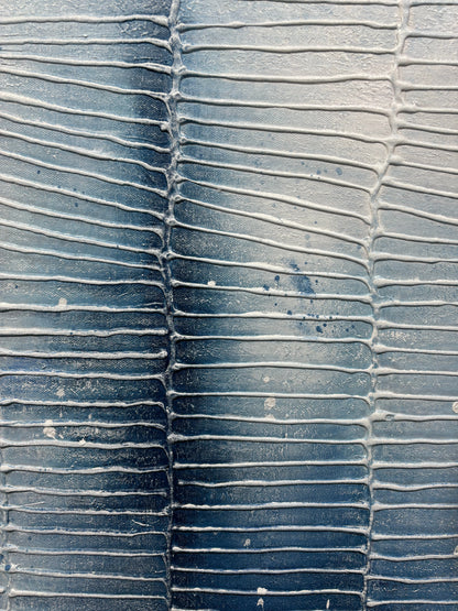 Close-up of textured blue surface with wavy pattern