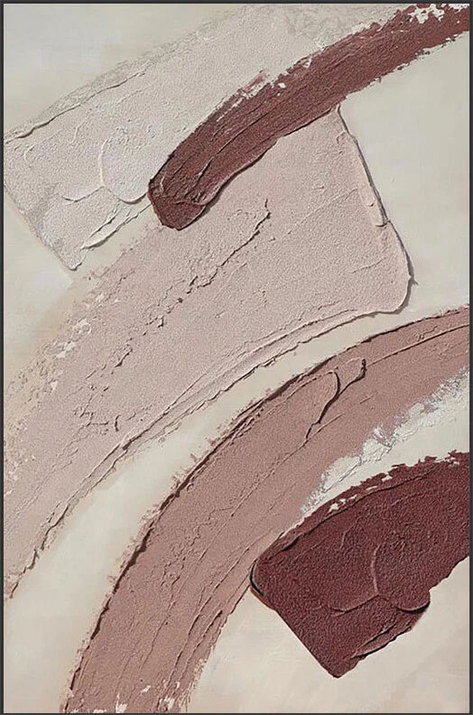 Close-up of brown and beige makeup swatches on a textured beige background