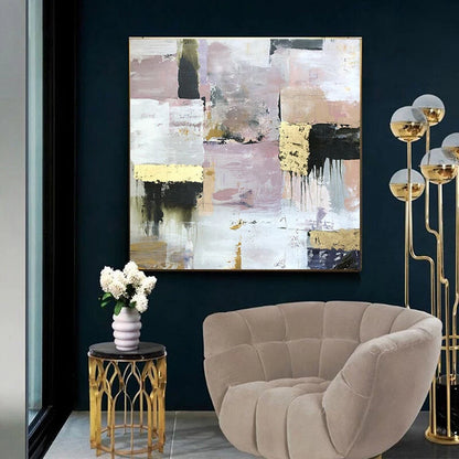 Modern interior with abstract painting, beige armchair, and decorative lamp.