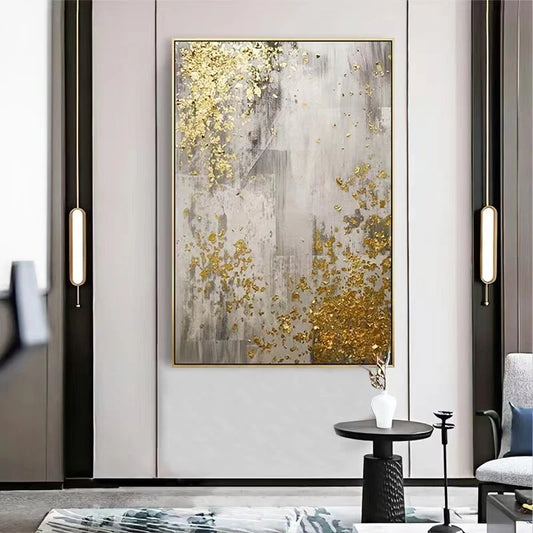 Abstract art piece with gold and gray colors in a modern living room setting.